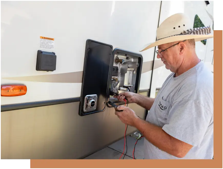 A man is working on an electrical device.